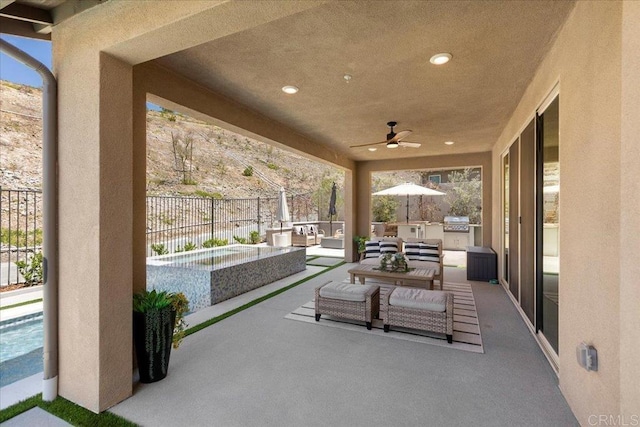 940 Lindbergh Dr, San Marcos, CA 92069 - fenced backyard featuring an outdoor kitchen, an outdoor living space, a patio area, a pool, and a ceiling fan