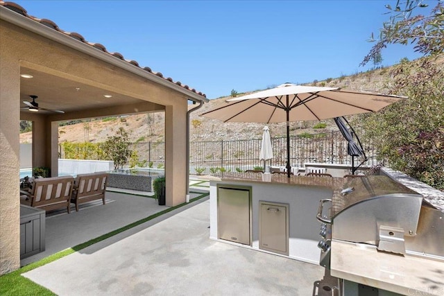 940 Lindbergh Dr, San Marcos, CA 92069 - view of patio with an outdoor kitchen, ceiling fan, and outdoor lounge area