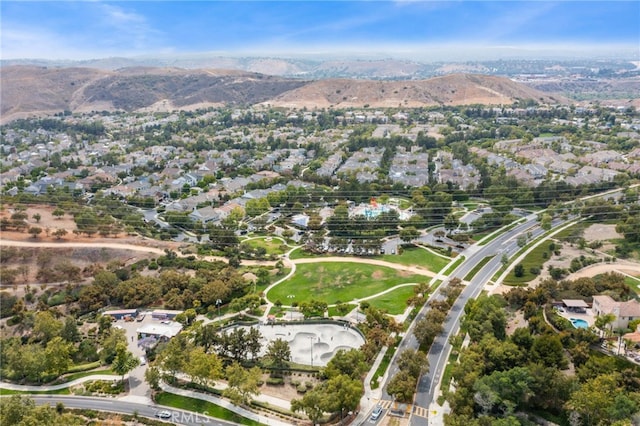 aerial overview of property's location featuring mountains and nearby suburban area
