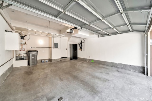 garage with a garage door opener, water heater, and baseboards