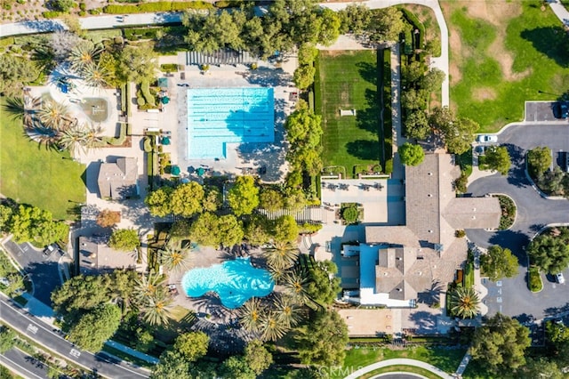 aerial view of property's location featuring a pool