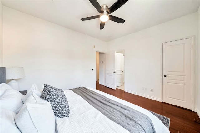 bedroom with wood finished floors, baseboards, and a ceiling fan