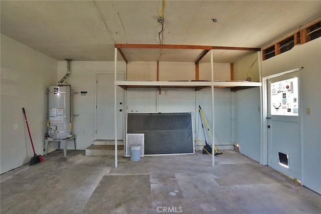 garage featuring strapped water heater