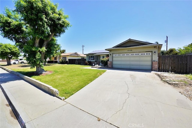 ranch-style home with solar panels, concrete driveway, an attached garage, and brick siding