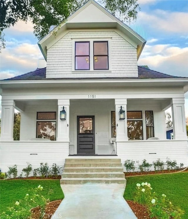 1151 W 14th St, San Pedro, CA 90731 - view of front of property with covered porch, a front yard, and a shingled roof