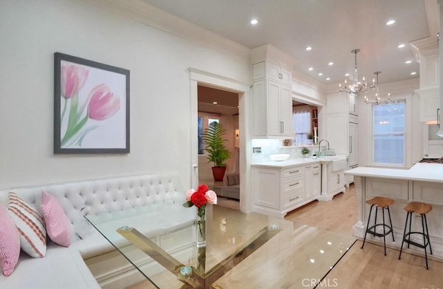 1151 W 14th St, San Pedro, CA 90731 - living room featuring a chandelier, light wood-type flooring, and recessed lighting