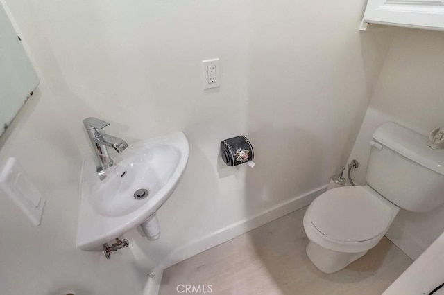 1151 W 14th St, San Pedro, CA 90731 - half bath featuring a sink, toilet, and baseboards