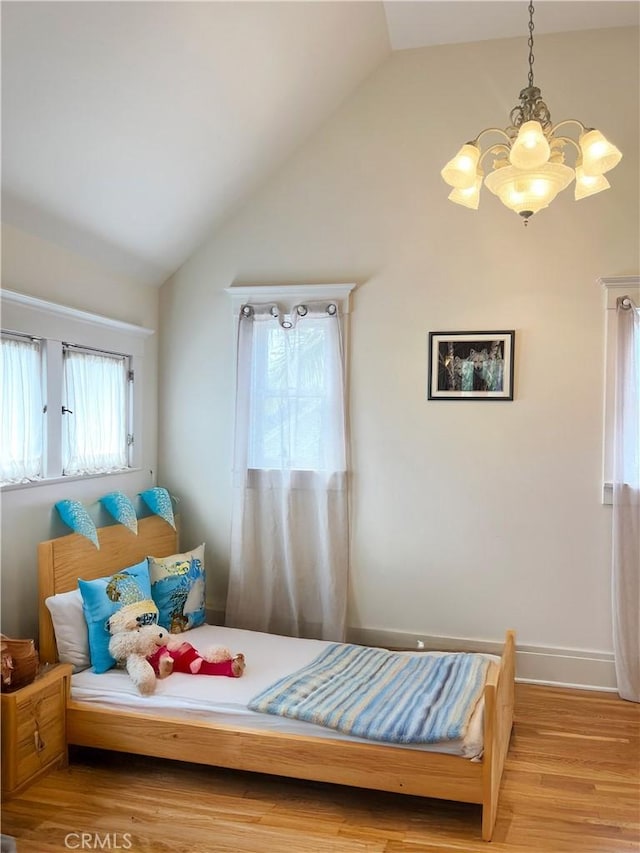 1151 W 14th St, San Pedro, CA 90731 - bedroom featuring vaulted ceiling, a chandelier, and wood finished floors