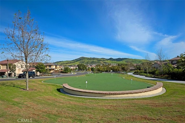 16 Abarrota St, Rancho Mission Viejo, CA 92694 - view of home's community featuring a putting area, a mountain view, and a yard