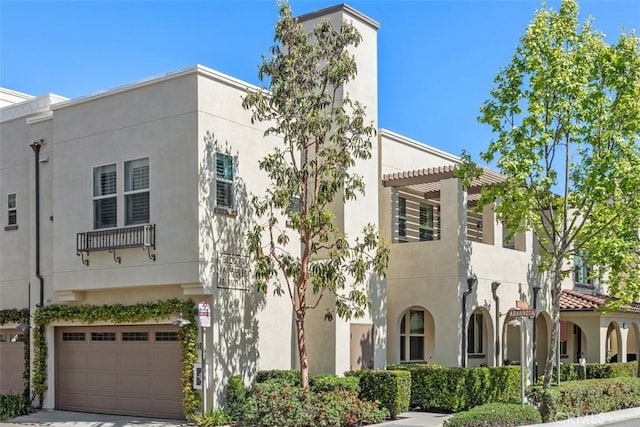 16 Abarrota St, Rancho Mission Viejo, CA 92694 - view of building exterior with an attached garage and concrete driveway
