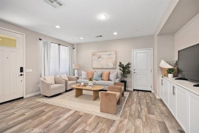 16 Abarrota St, Rancho Mission Viejo, CA 92694 - living room with light wood-style flooring, baseboards, and recessed lighting
