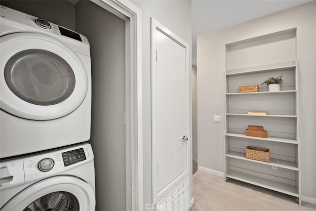 16 Abarrota St, Rancho Mission Viejo, CA 92694 - laundry area with stacked washer / drying machine, carpet flooring, and baseboards