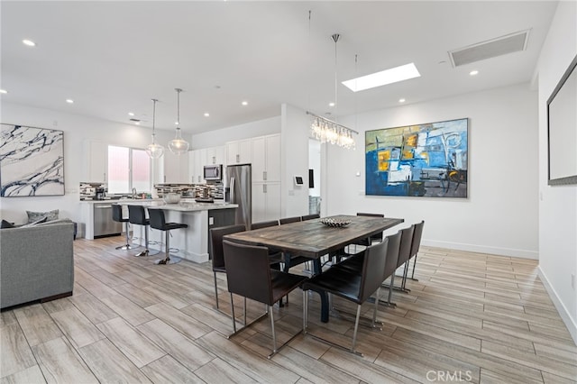54060 Avenida Madero Ln, Quinta, CA 92253 - dining area with light wood finished floors, recessed lighting, and baseboards