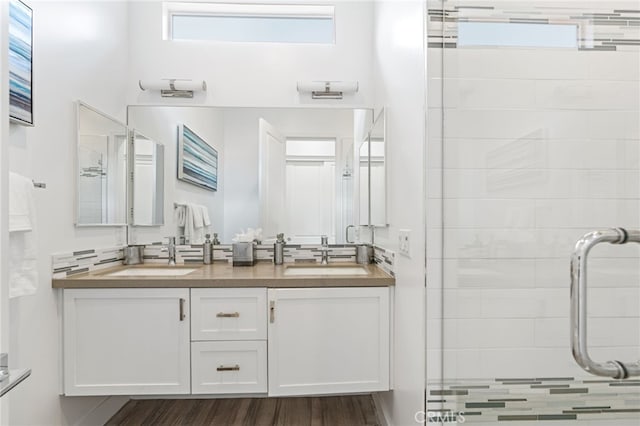 54060 Avenida Madero Ln, Quinta, CA 92253 - bathroom featuring a stall shower, double vanity, and wood finished floors