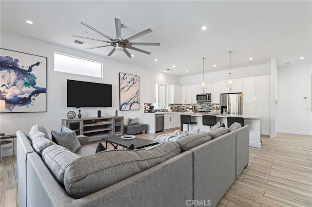 54060 Avenida Madero Ln, Quinta, CA 92253 - living area with a ceiling fan, recessed lighting, light wood-style flooring, and baseboards