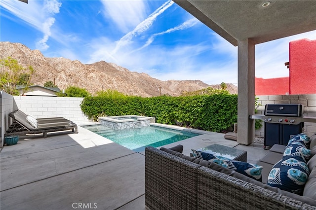 54060 Avenida Madero Ln, Quinta, CA 92253 - view of swimming pool with a grill, a patio area, a mountain view, a fenced backyard, and a pool with connected hot tub