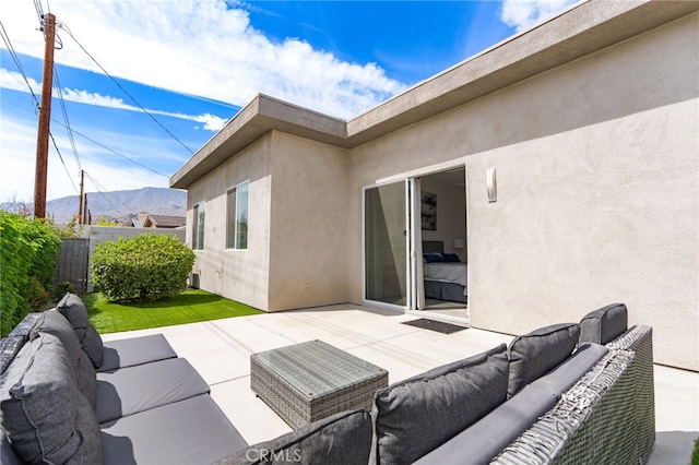 54060 Avenida Madero Ln, Quinta, CA 92253 - view of patio with an outdoor living space, fence, and a mountain view