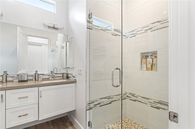 54060 Avenida Madero Ln, Quinta, CA 92253 - bathroom featuring a stall shower, vanity, and wood finished floors