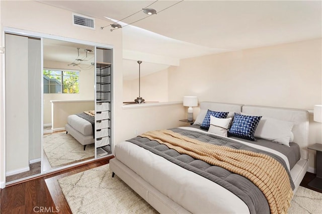 5530 Owensmoutth Ave Unit 306, Woodland Hills, CA 91367 - bedroom with a closet, wood finished floors, and baseboards
