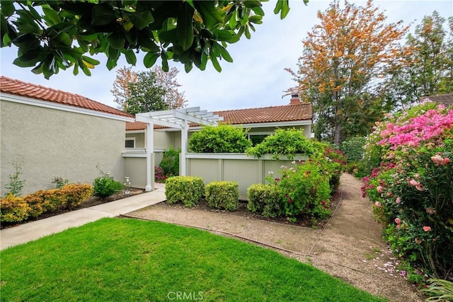 3268 San Amadeo Unit C, Laguna Woods, CA 92637 - view of yard with a pergola