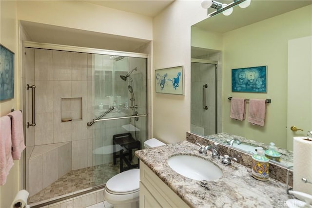 3268 San Amadeo Unit C, Laguna Woods, CA 92637 - bathroom with toilet, a shower stall, and vanity
