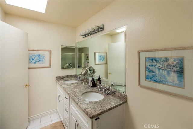 3268 San Amadeo Unit C, Laguna Woods, CA 92637 - bathroom with tile patterned flooring, double vanity, and baseboards
