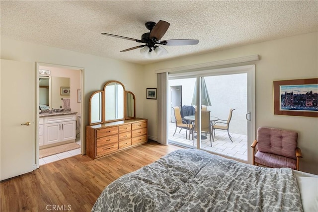 3268 San Amadeo Unit C, Laguna Woods, CA 92637 - bedroom featuring access to exterior, light wood finished floors, connected bathroom, a textured ceiling, and a ceiling fan
