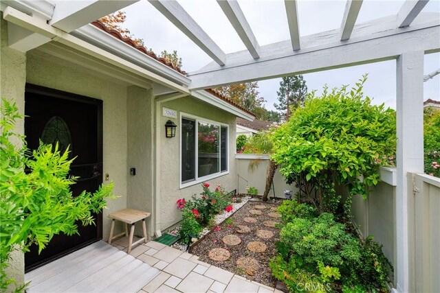 3268 San Amadeo Unit C, Laguna Woods, CA 92637 - property entrance featuring stucco siding and fence