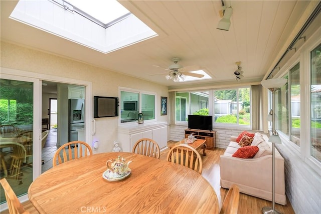3268 San Amadeo Unit C, Laguna Woods, CA 92637 - sunroom with a skylight and wood finished floors