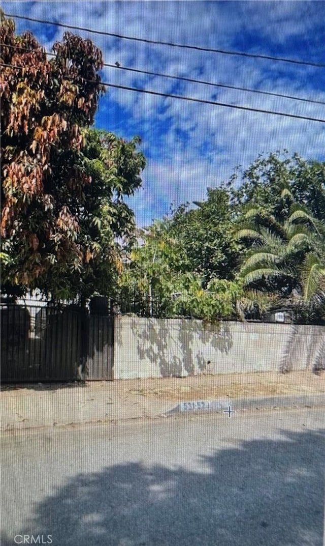 view of side of home with fence