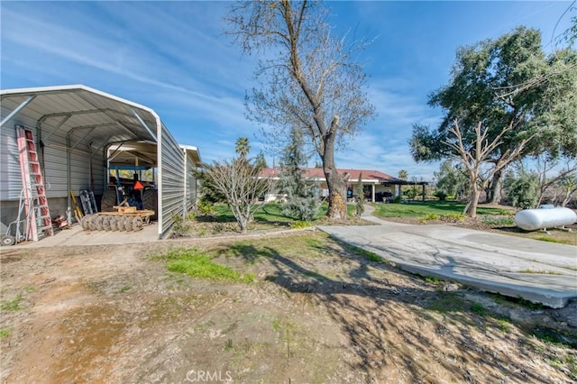 view of yard with a carport