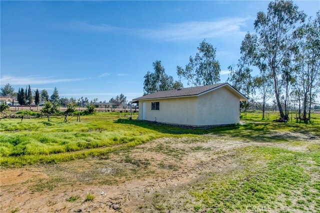 view of property exterior featuring fence