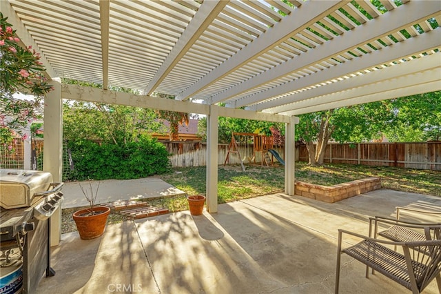 view of patio / terrace with a playground, a grill, and a pergola