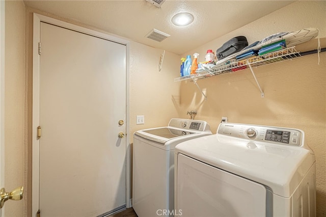 washroom featuring independent washer and dryer