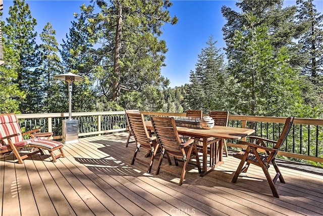 wooden deck with outdoor dining space