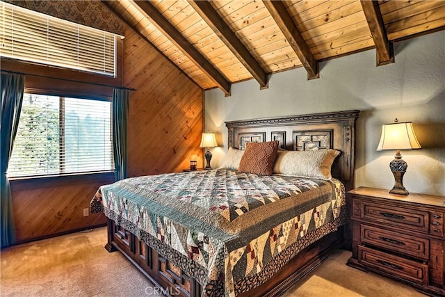 carpeted bedroom with wooden walls and wooden ceiling