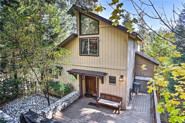 chalet / cabin with a wooden deck