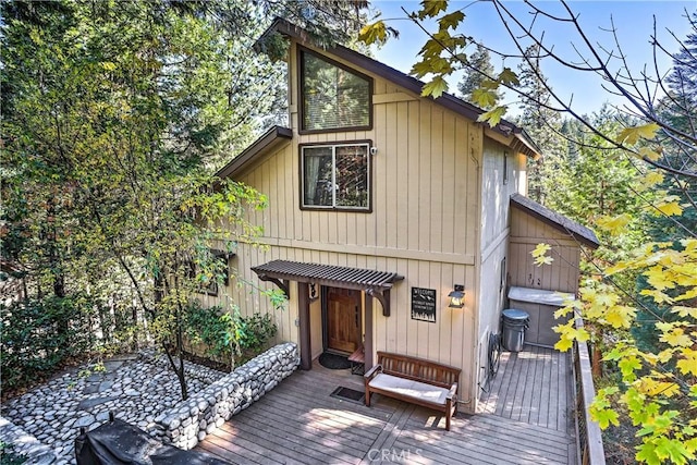 rustic home with a wooden deck