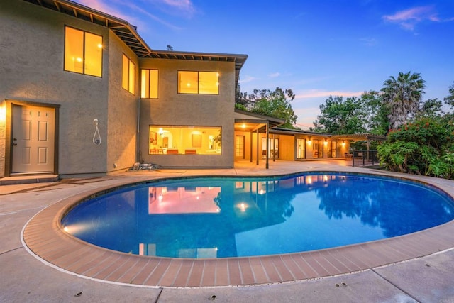 outdoor pool with a patio