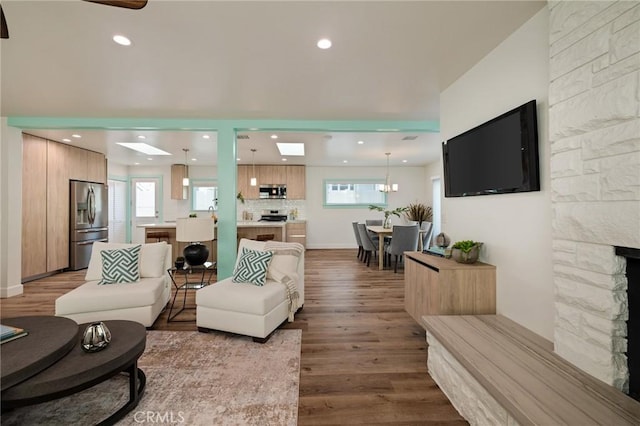 225 S Guadalupe Ave, Redondo Beach, CA 90277 - living room with wood finished floors, recessed lighting, plenty of natural light, and a fireplace