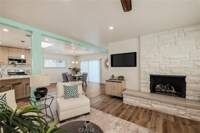 225 S Guadalupe Ave, Redondo Beach, CA 90277 - living room featuring wood finished floors, recessed lighting, and a fireplace