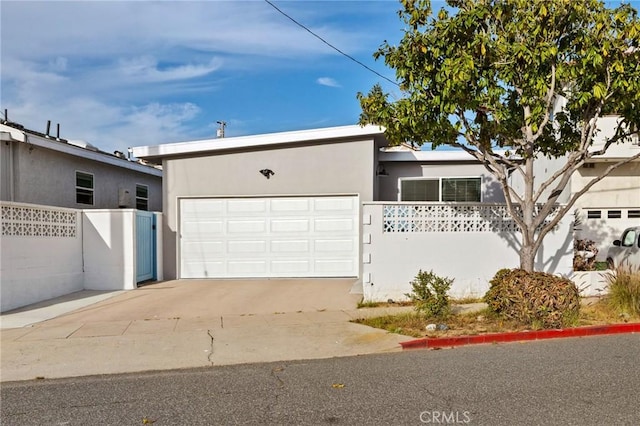 225 S Guadalupe Ave, Redondo Beach, CA 90277 - mid-century inspired home featuring an attached garage, concrete driveway, and stucco siding