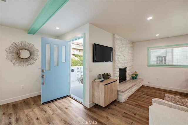 225 S Guadalupe Ave, Redondo Beach, CA 90277 - entryway featuring light wood-style flooring, beam ceiling, baseboards, a fireplace, and recessed lighting