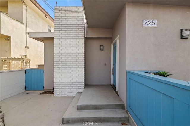 225 S Guadalupe Ave, Redondo Beach, CA 90277 - view of exterior entry featuring stucco siding and brick siding