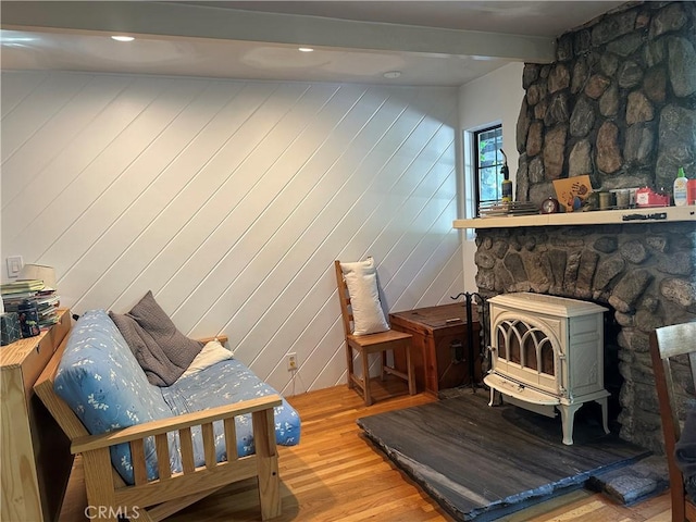 30 Bear Dr, Mt Baldy, CA 91759 - living area featuring a wood stove, wood finished floors, and beamed ceiling