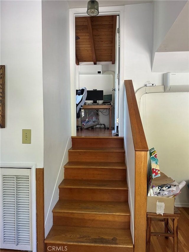 30 Bear Dr, Mt Baldy, CA 91759 - stairway with wood ceiling with exposed beams, wood finished floors, and a wall mounted air conditioner