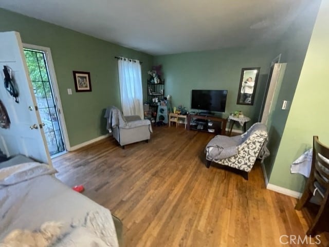 6705 Denny Ave, North Hollywood, CA 91606 - living room featuring healthy amount of natural light, wood finished floors, and baseboards