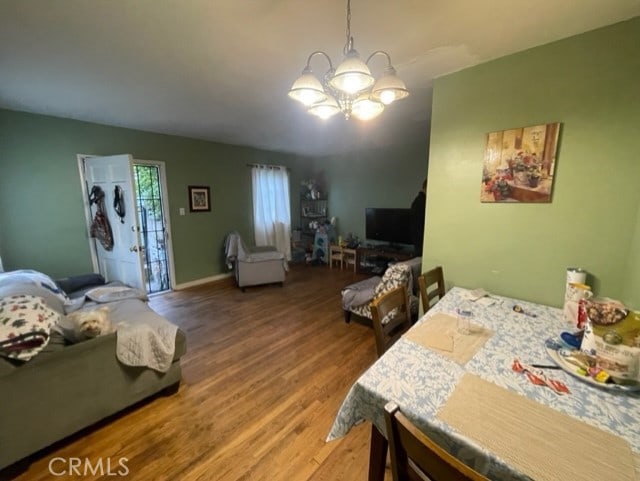 6705 Denny Ave, North Hollywood, CA 91606 - dining area with a chandelier and wood finished floors