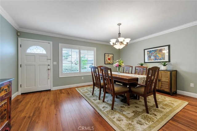 17152 Friml Ln, Huntington Beach, CA 92649 - dining space featuring a chandelier, baseboards, wood finished floors, and ornamental molding