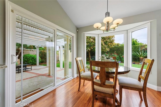 17152 Friml Ln, Huntington Beach, CA 92649 - dining room featuring a chandelier, light wood-style floors, lofted ceiling, and baseboards